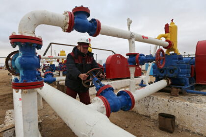 A Worker Checks The Pressure Of Pumps At An Oil Pumping Station In The Uzen Oil And Gas Field In The Mangistau Region